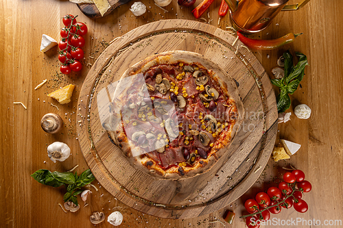 Image of Top view of pizza capricciosa