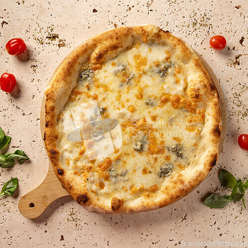 Image of Freshly baked four cheese pizza