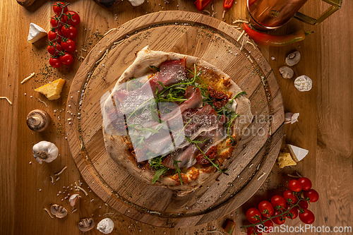 Image of Artisan pizza with sun-dried tomatoes