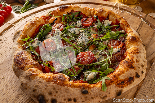 Image of Savory pizza topped with fresh tomatoes