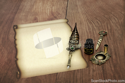 Image of Faded Parchment Paper Scroll with Feather Quill Pen