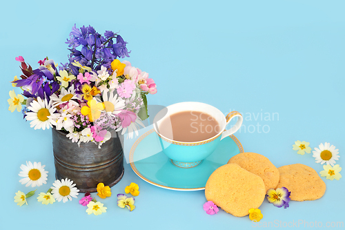 Image of White Chocolate Chip Cookies Tea Cup and Spring Flowers