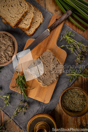 Image of Liver pate being served on rustic table