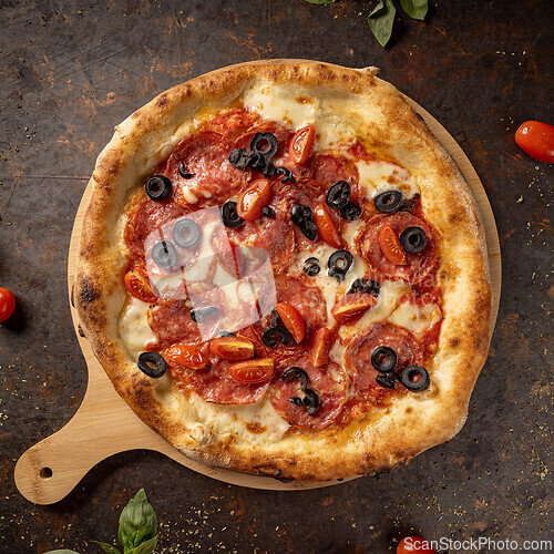 Image of Delicious pizza with black olives