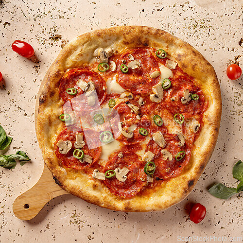 Image of Freshly baked pizza with melted mozzarella