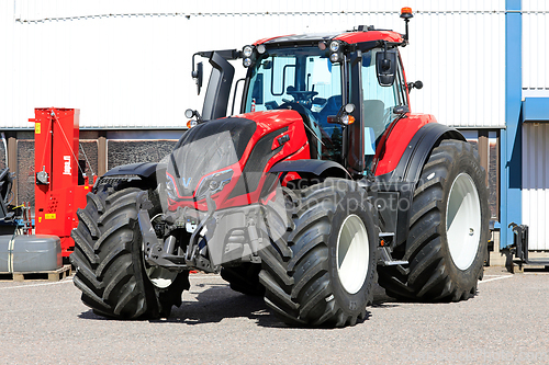 Image of Red Valtra T235 Tractor on a Yard