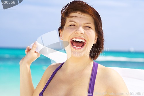 Image of happy woman with white sarong