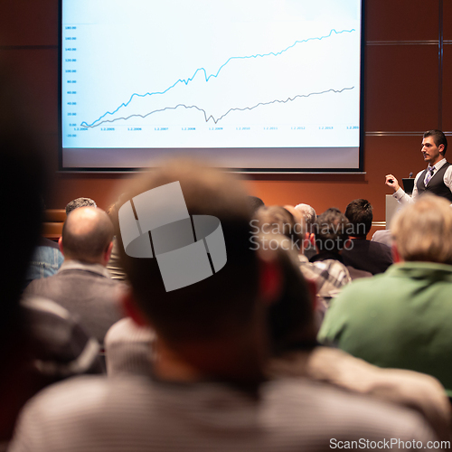 Image of Business speaker giving a talk at business conference meeting event.