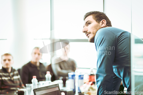 Image of Manager giving business presentation on corporate meeting event.