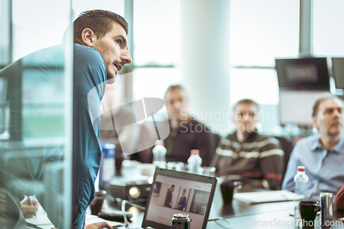 Image of Manager giving business presentation on corporate meeting event.