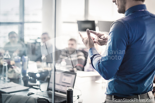 Image of Manager giving business presentation on corporate meeting event.