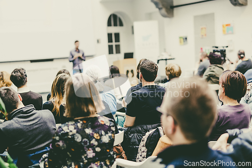 Image of Man giving presentation in lecture hall at university.
