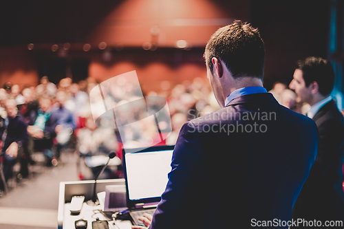 Image of Speaker at Business Conference and Presentation.