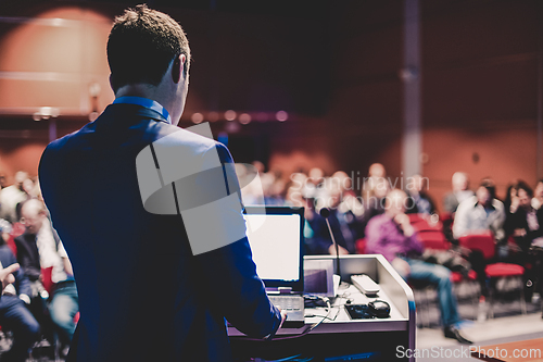 Image of Speaker at Business Conference and Presentation.