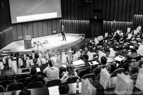 Image of Speaker giving presentation on business conference event.