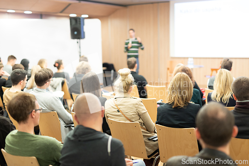 Image of Female speaker giving presentation on business conference.