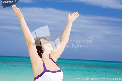 Image of happy woman on the beach