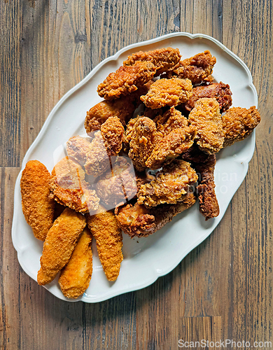 Image of fried chicken wings and fillet pieces