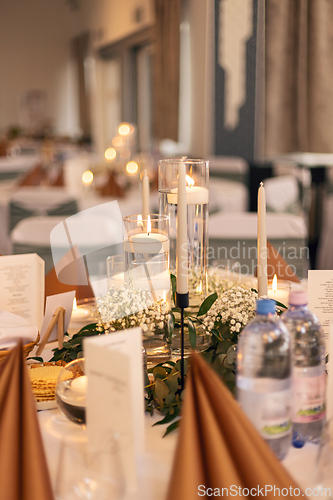 Image of Intimate and warm candlelit table setting