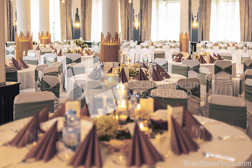 Image of Sophisticated reception setup with decorated tables