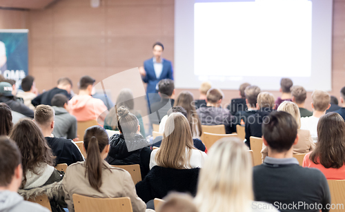 Image of Business speaker giving a talk at business conference event.