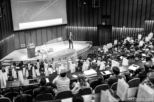 Image of Speaker giving presentation on business conference event.