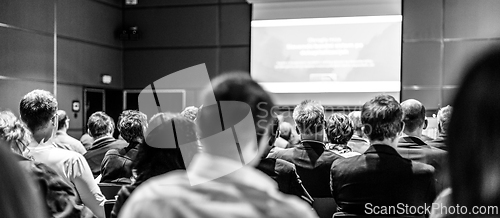 Image of Speaker giving presentation on scientific business conference.