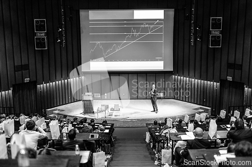Image of Speaker giving presentation on business conference event.