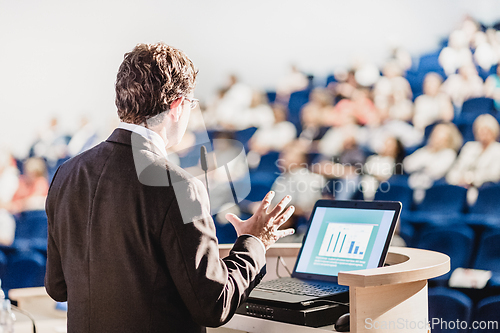 Image of Speaker at Business Conference and Presentation.