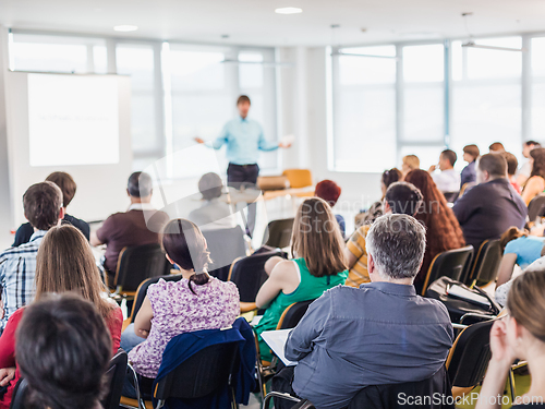 Image of Speaker giving presentation on business conference.