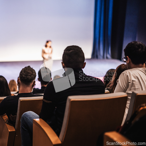 Image of Woman giving presentation on business conference event.