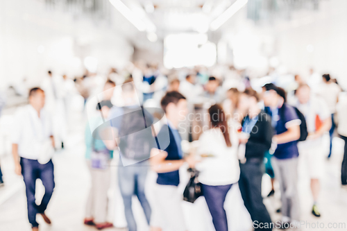 Image of Abstract blurred people socializing during lunch break at business conference.