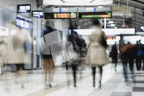 Image of Business people traveling by Tokyo metro.