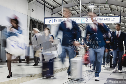 Image of Business people traveling by Tokyo metro.