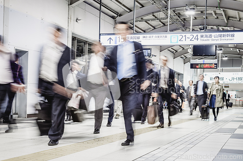 Image of Business people traveling by Tokyo metro.