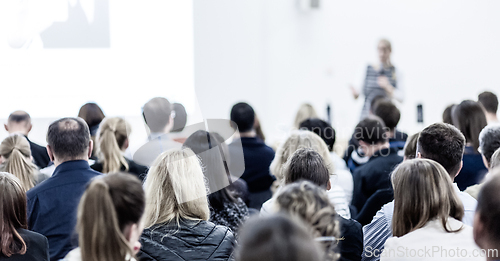 Image of Woman giving presentation on business conference.