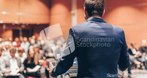 Image of Speaker at Business Conference and Presentation.