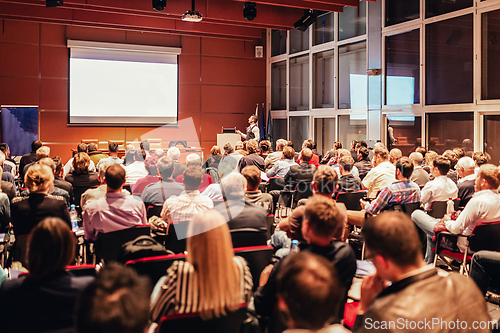 Image of Speaker at Business Conference and Presentation.