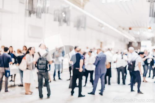 Image of Abstract blurred people socializing during coffee break at business conference.