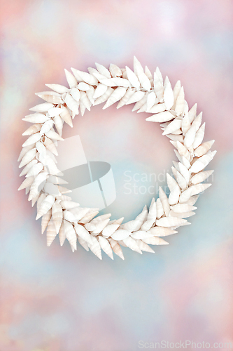 Image of Cerithium White Sea Shell Wreath on Rainbow Sky background