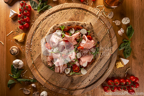 Image of Italian pizza filled with mortadella and cheese