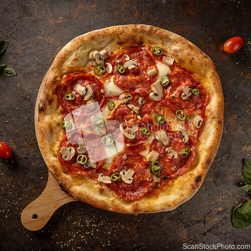 Image of Delicious pizza with salami
