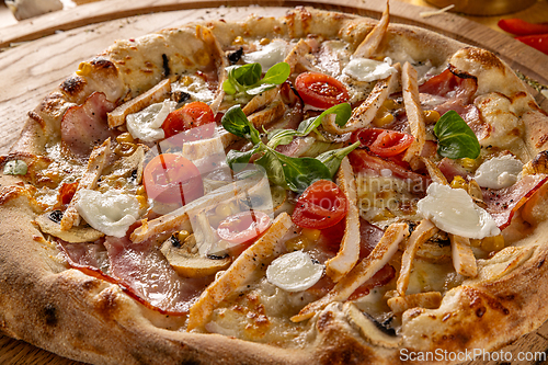 Image of Gourmet pizza with bacon