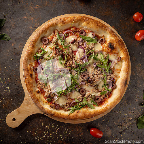 Image of Freshly baked tuna pizza with mozzarella