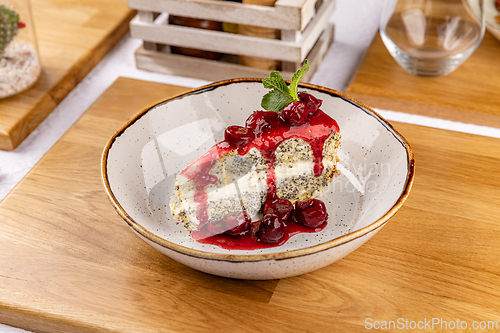 Image of Poppy seed cake with cherry topping