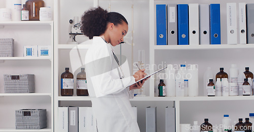 Image of Woman, scientist and clipboard for inventory in lab stock room for equipment check and analyse products. Female pharmacist, checklist and bottles chemical supply in laboratory for research and work.