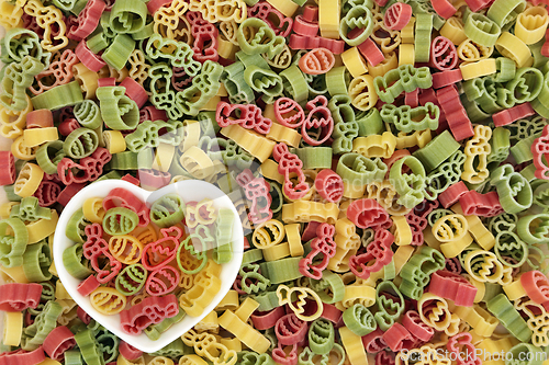 Image of Uncooked Tricolor Easter Pasta Food Background
