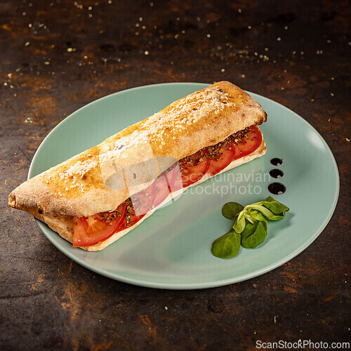 Image of Freshly baked panini with juicy tomatoes