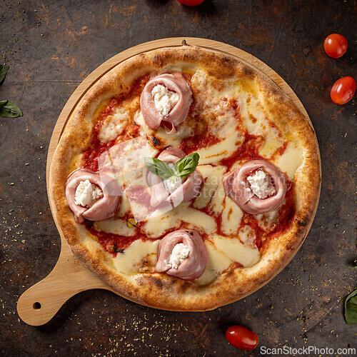 Image of Delicious pizza with ham and ricotta cheese