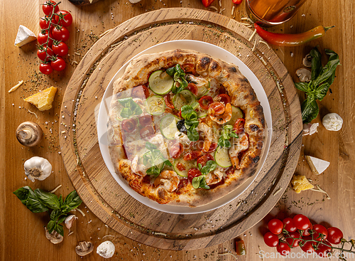Image of Gourmet pizza with zucchini and shrimp